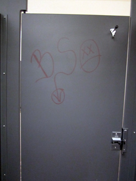 Graffiti on the stall door in the women's bathroom (Photo by Brenda Arce)